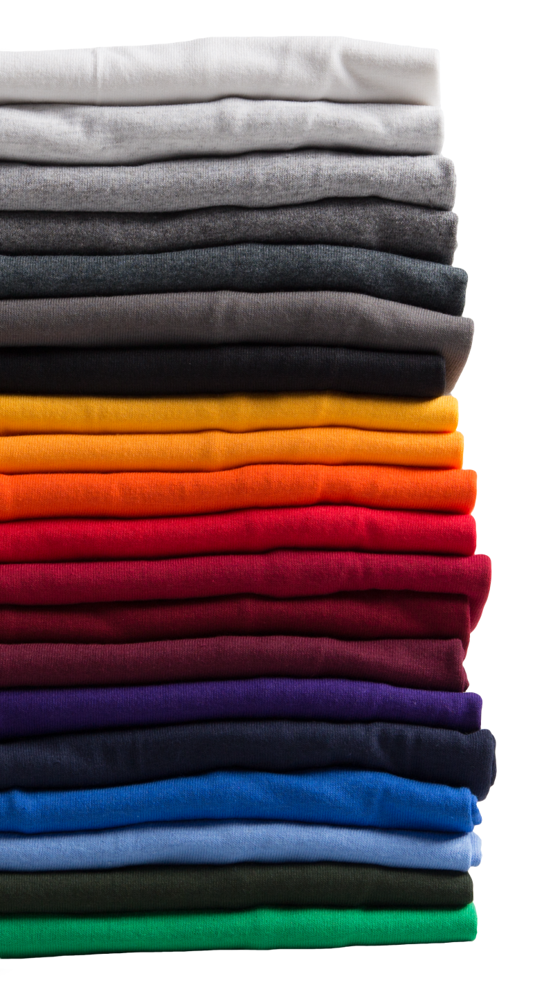 A stack of folded shirts with a variety of colors