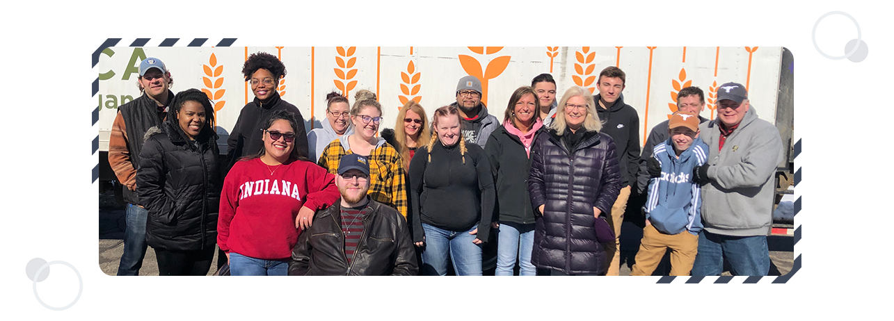 Corporate-Responsibility: Group photo of Perrin employees volunteering for Feeding America